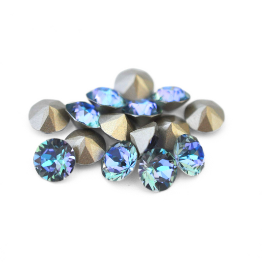 Round faceted Austrian crystal rhinestones in the color Aqua Vitrail Light displayed on a white background.