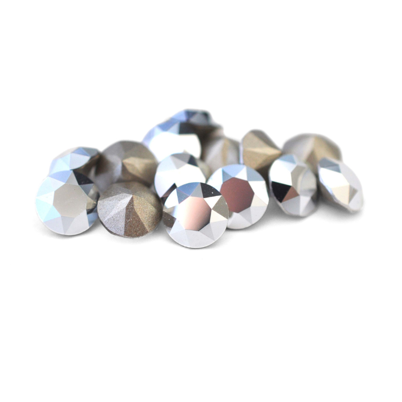 Round faceted Austrian crystal rhinestones in the color Comet Argent Light displayed on a white background.