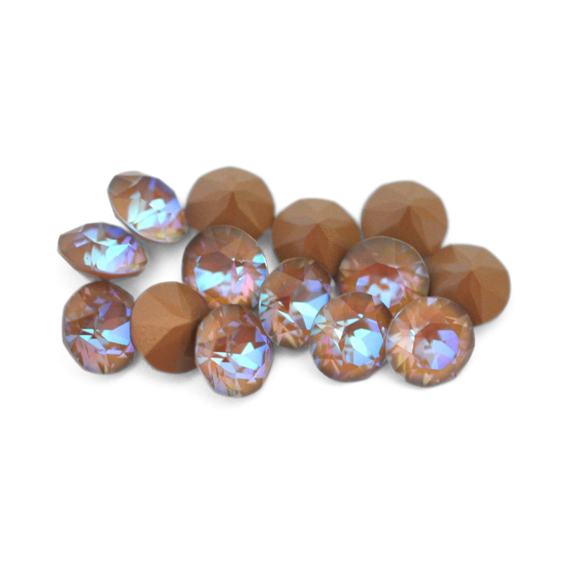 Round faceted Austrian crystal rhinestones in the color Cappuccino Delite displayed on a white background.