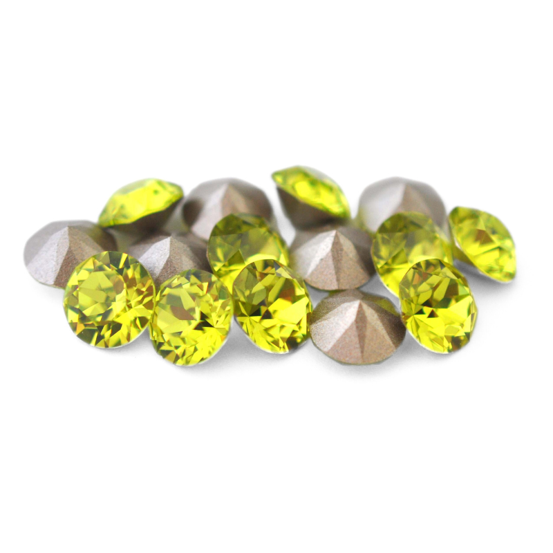Round faceted Austrian crystal rhinestones in the color Citrus Green displayed on a white background.