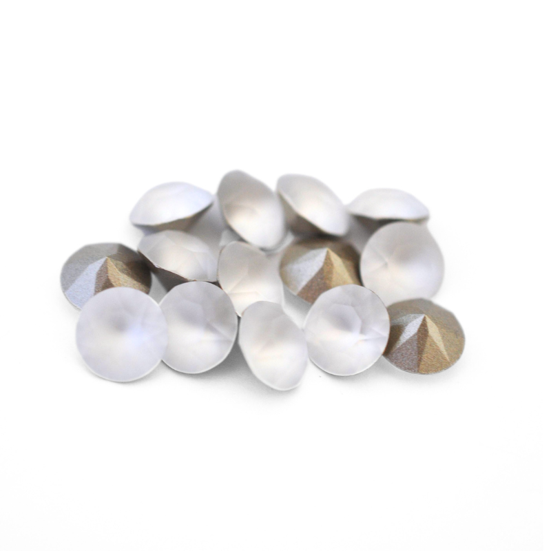 Round faceted Austrian crystal rhinestones in the color Crystal Matt displayed on a white background.