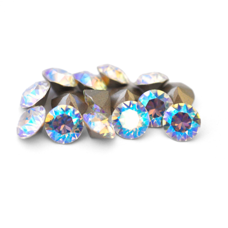 Round faceted Austrian crystal rhinestones in the color Crystal Shimmer displayed on a white background.