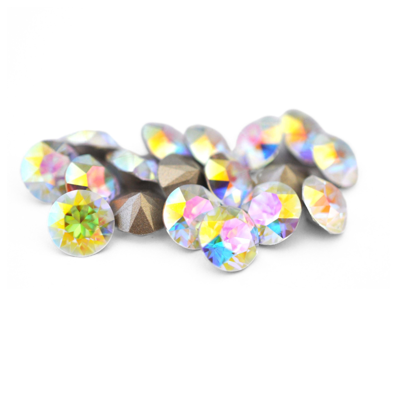 Round faceted Austrian crystal rhinestones in the color Crystal Transmission displayed on a white background.