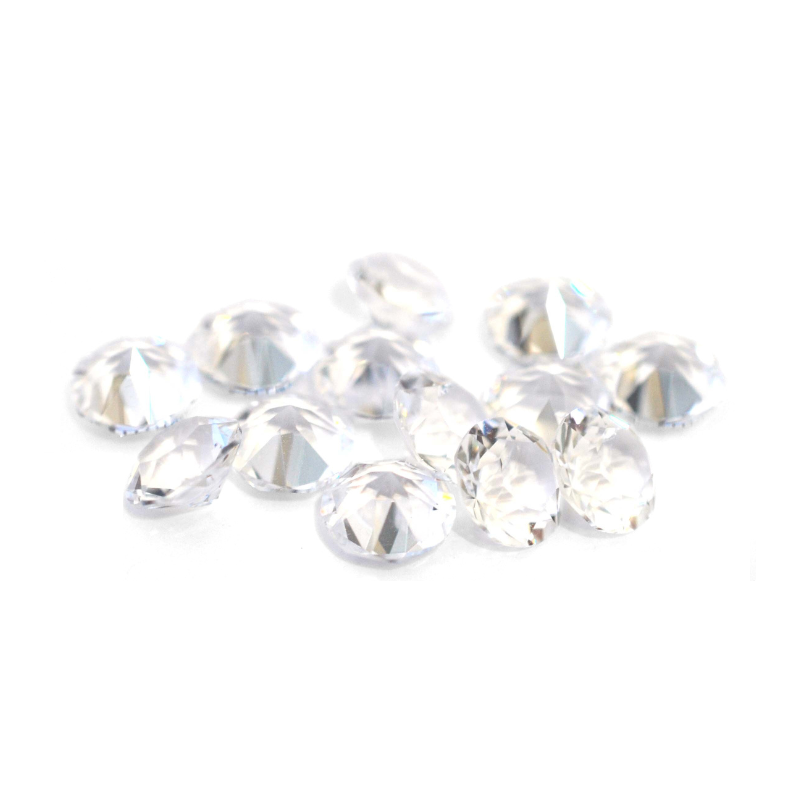 Round faceted Austrian crystal rhinestones in the color Crystal Unfoiled displayed on a white background.