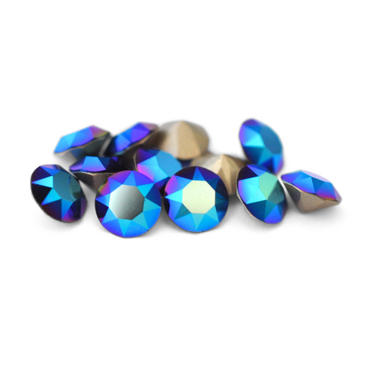 Round faceted Austrian crystal rhinestones in the color Dark Indigo Shimmer displayed on a white background