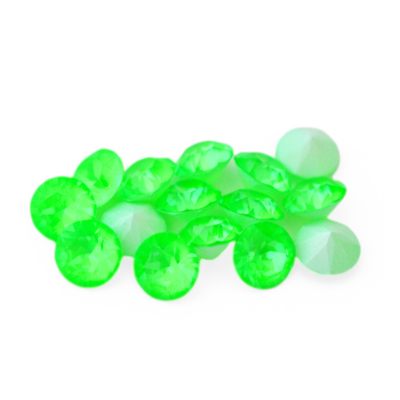 Round faceted Austrian crystal rhinestones in the color Electric Green Ignite displayed on a white background.
