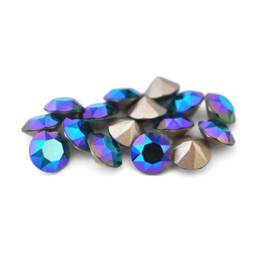 Round faceted Austrian crystal rhinestones in the color Emerald Blue AB displayed on a white background.