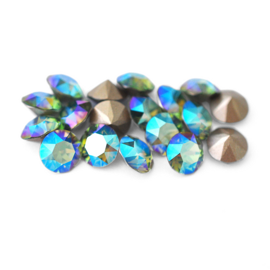 Round faceted Austrian crystal rhinestones in the color Erinite Shimmer displayed on a white background.