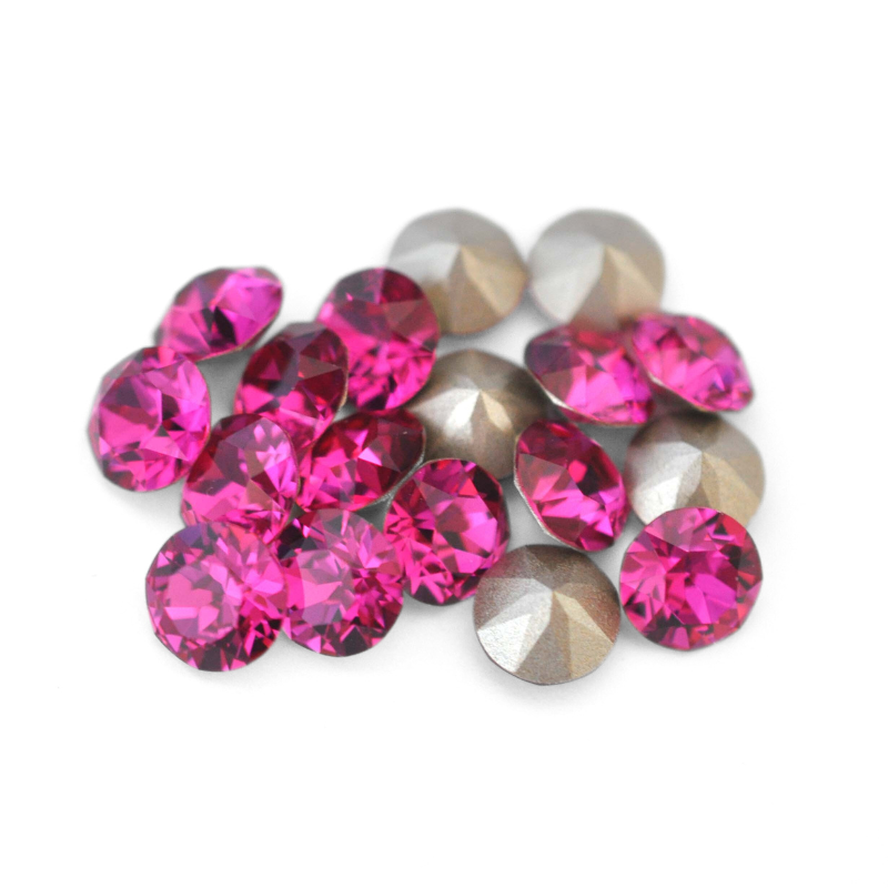 Round faceted Austrian crystal rhinestones in the color Fuchsia displayed on a white background.