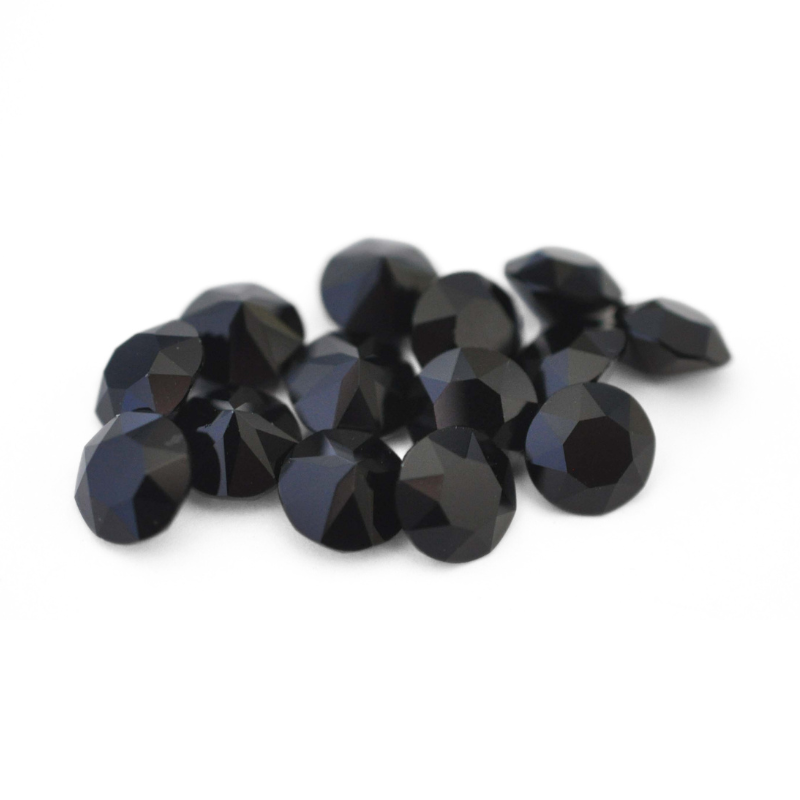 Round faceted Austrian crystal rhinestones in the color Jet Black displayed on a white background.