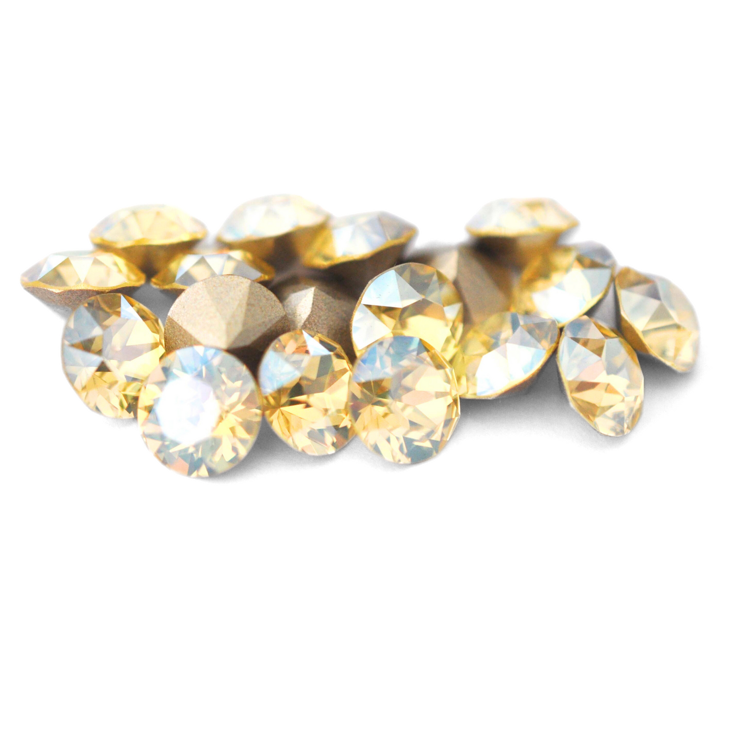 Round faceted Austrian crystal rhinestones in the color Jonquil Moonlight displayed on a white background.