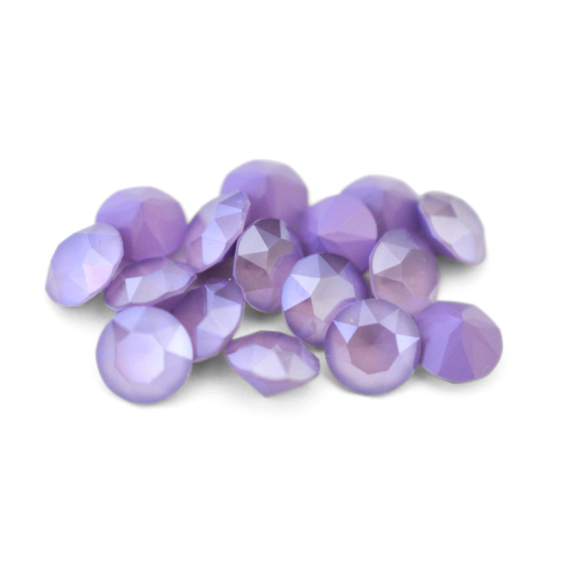 Round faceted Austrian crystal rhinestones in the color Lilac displayed on a white background.