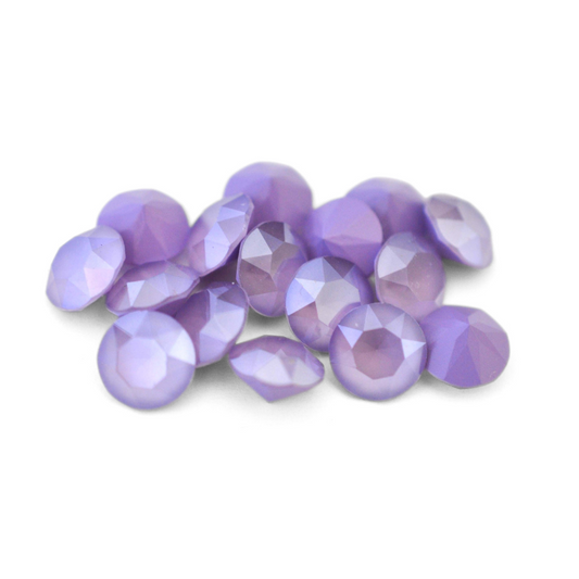 Round faceted Austrian crystal rhinestones in the color Lilac displayed on a white background.