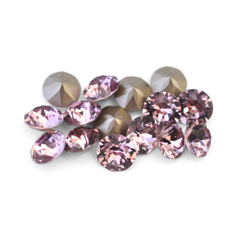 Round faceted Austrian crystal rhinestones in the color Light Amethyst displayed on a white background.
