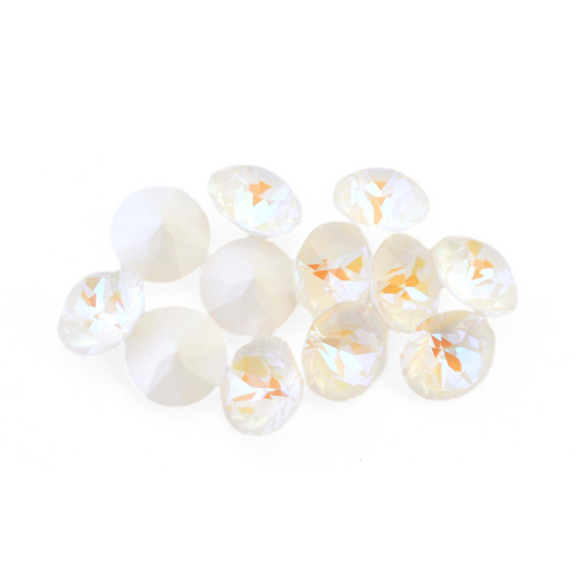 Round faceted Austrian crystal rhinestones in the color Light Grey Delite displayed on a white background.