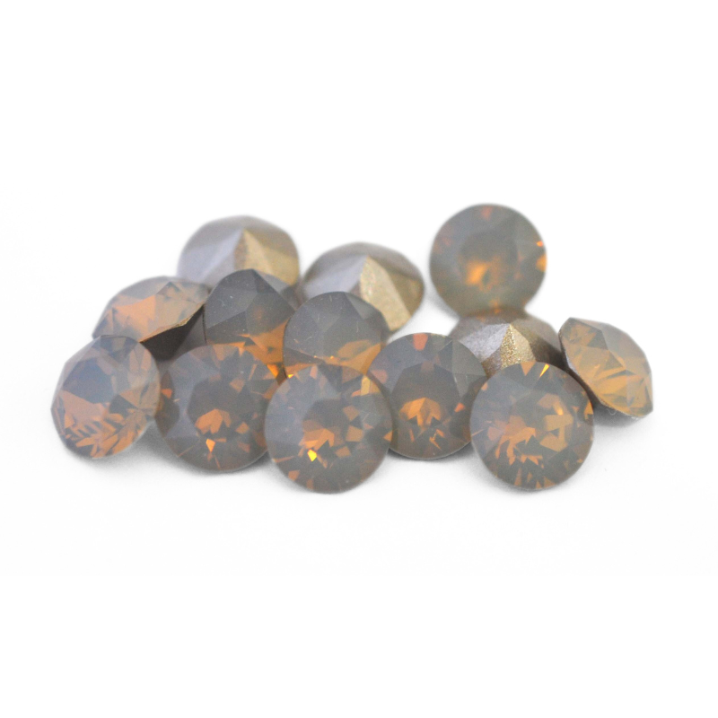 Round faceted Austrian crystal rhinestones in the color Light Grey Opal displayed on a white background.
