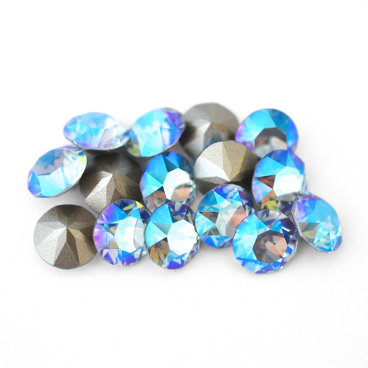 Round faceted Austrian crystal rhinestones in the color Light Sapphire Shimmer displayed on a white background