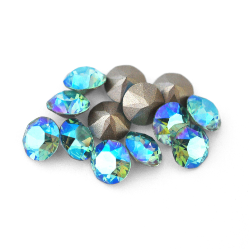 Round faceted Austrian crystal rhinestones in the color Light Turquoise Shimmer displayed on a white background