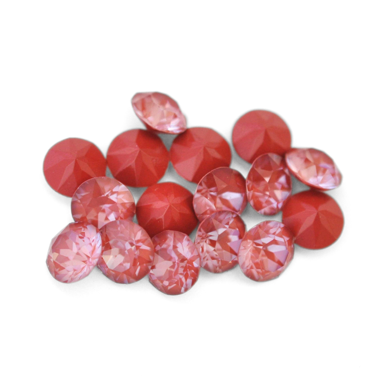 Round faceted Austrian crystal rhinestones in the color Maroon Ignite displayed on a white background.
