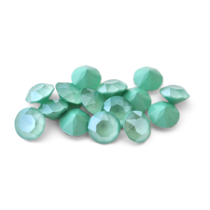 Round faceted Austrian crystal rhinestones in the color Mint Green displayed on a white background.