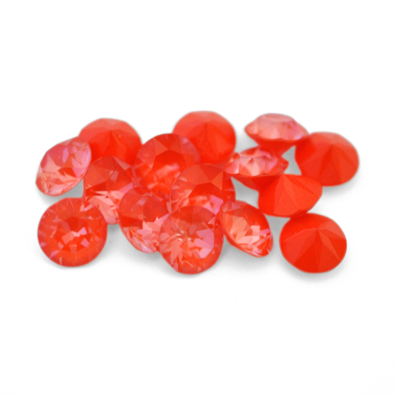Round faceted Austrian crystal rhinestones in the color Orange Ignite displayed on a white background.