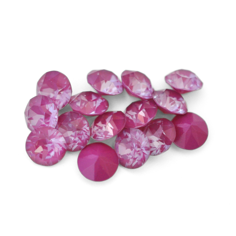 Round faceted Austrian crystal rhinestones in the color Orchid Ignite displayed on a white background.