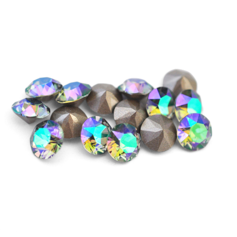 Round faceted Austrian crystal rhinestones in the color Paradise Shine displayed on a white background.