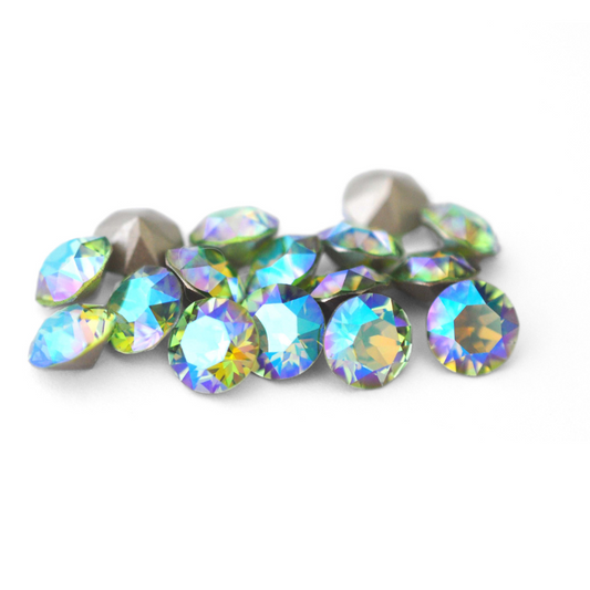 Round faceted Austrian crystal rhinestones in the color Peridot Blue AB displayed on a white background.