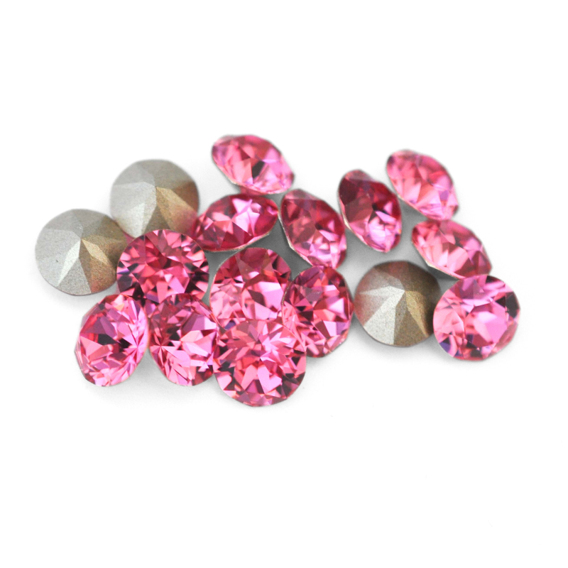 Round faceted Austrian crystal rhinestones in the color Rose displayed on a white background.