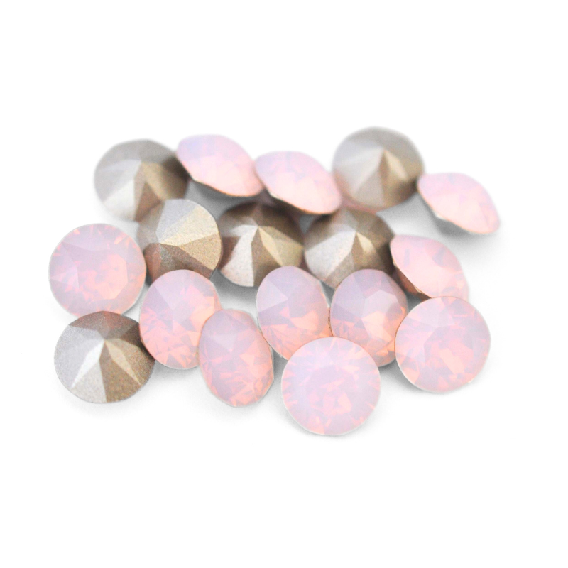 Round faceted Austrian crystal rhinestones in the color Rose Water Opal displayed on a white background.