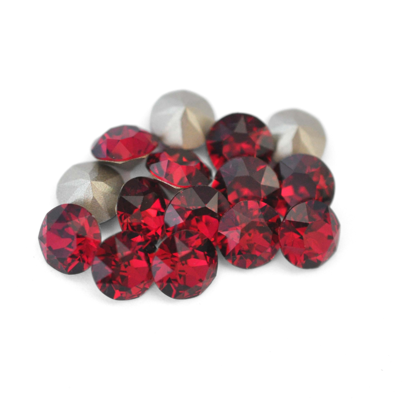 Round faceted Austrian crystal rhinestones in the color Ruby displayed on a white background.
