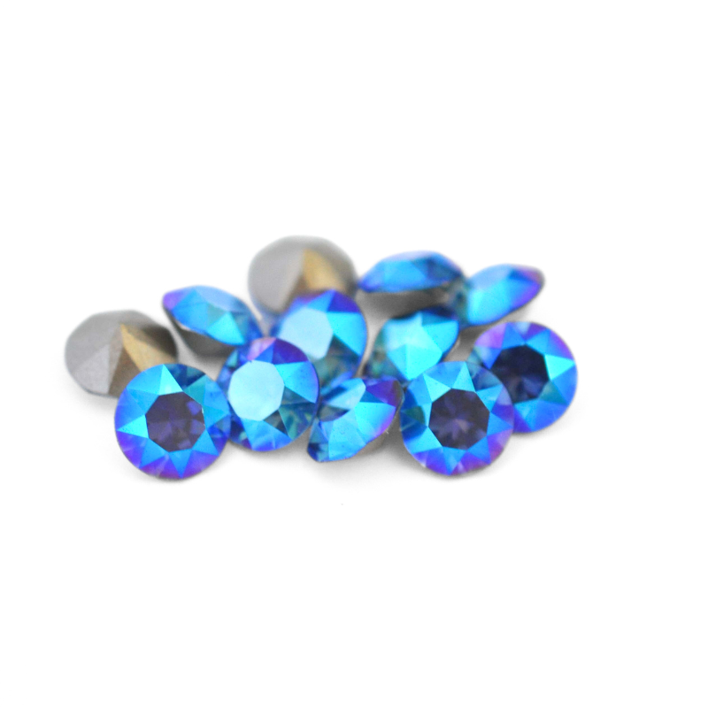 Round faceted Austrian crystal rhinestones in the color Sapphire Shimmer displayed on a white background.