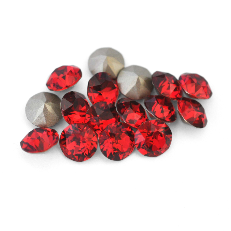 Round faceted Austrian crystal rhinestones in the color Scarlet displayed on a white background.
