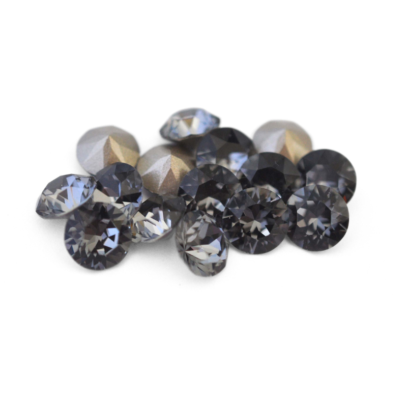 Round faceted Austrian crystal rhinestones in the color Silver Night displayed on a white background.