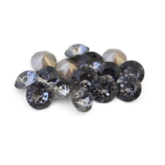 Round faceted Austrian crystal rhinestones in the color Silver Night displayed on a white background.