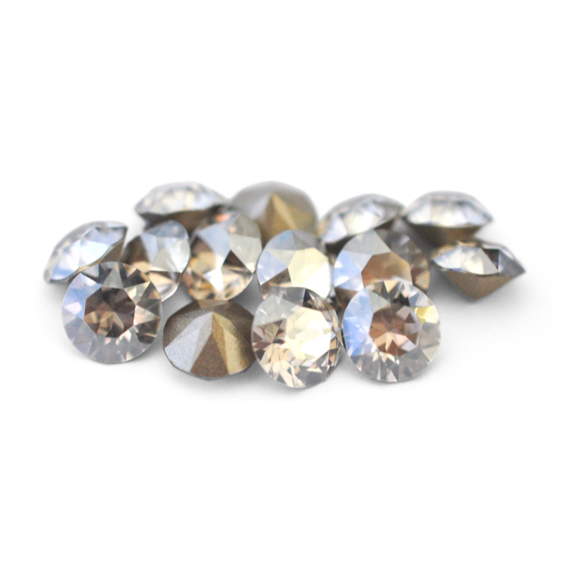Round faceted Austrian crystal rhinestones in the color Silver Night displayed on a white background.
