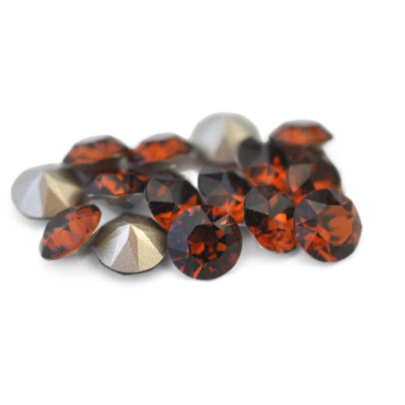 Round faceted Austrian crystal rhinestones in the color Smoked Topaz displayed on a white background.