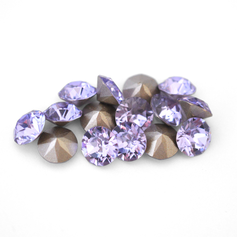 Round faceted Austrian crystal rhinestones in the color Violet displayed on a white background.
