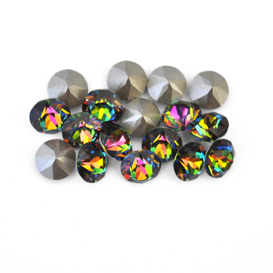Round faceted Austrian crystal rhinestones in the color Vitrail Medium displayed on a white background.