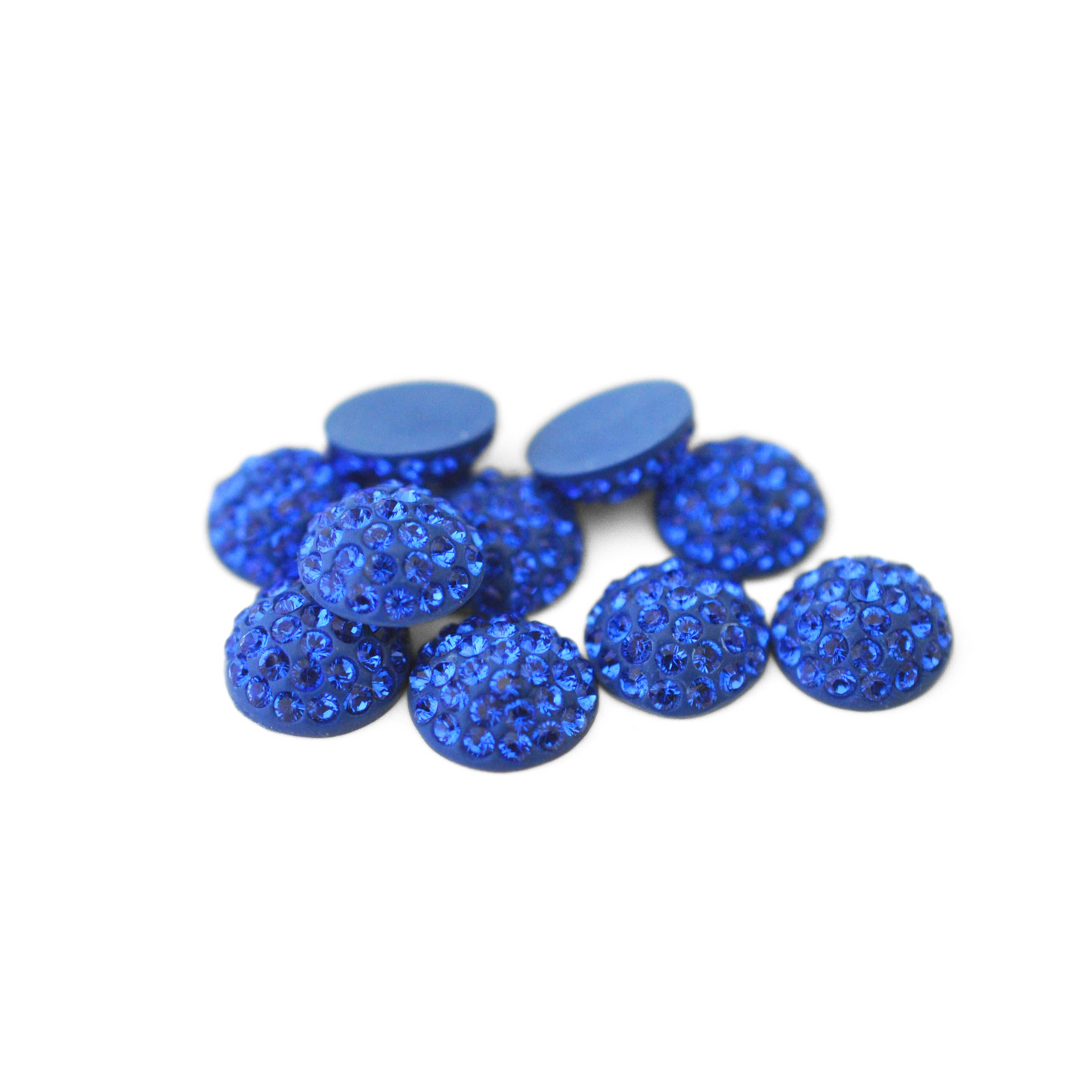 Round Pave Cabochons with Austrian crystal rhinestones in the color Majestic Blue displayed on a white background