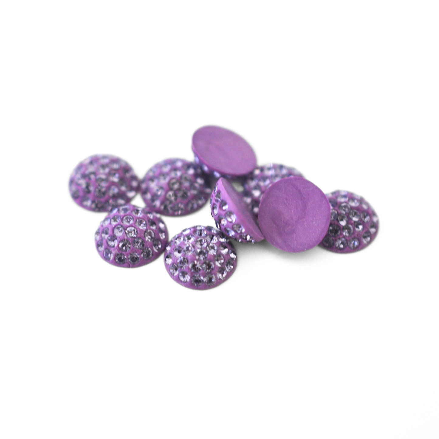 Round Pave Cabochons with Austrian crystal rhinestones in the color Violet displayed on a white background