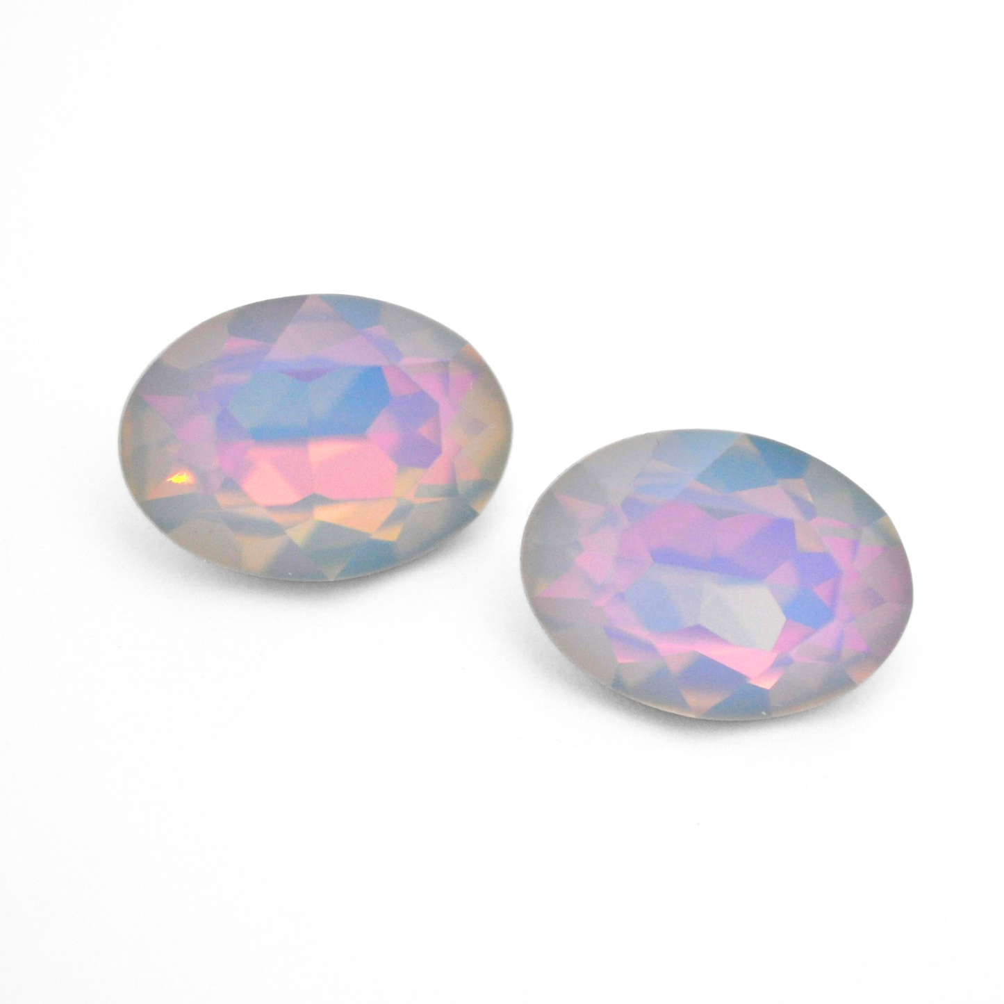 Oval shape faceted Austrian crystal rhinestones in the color Dreamy Vitrail displayed on a white background.