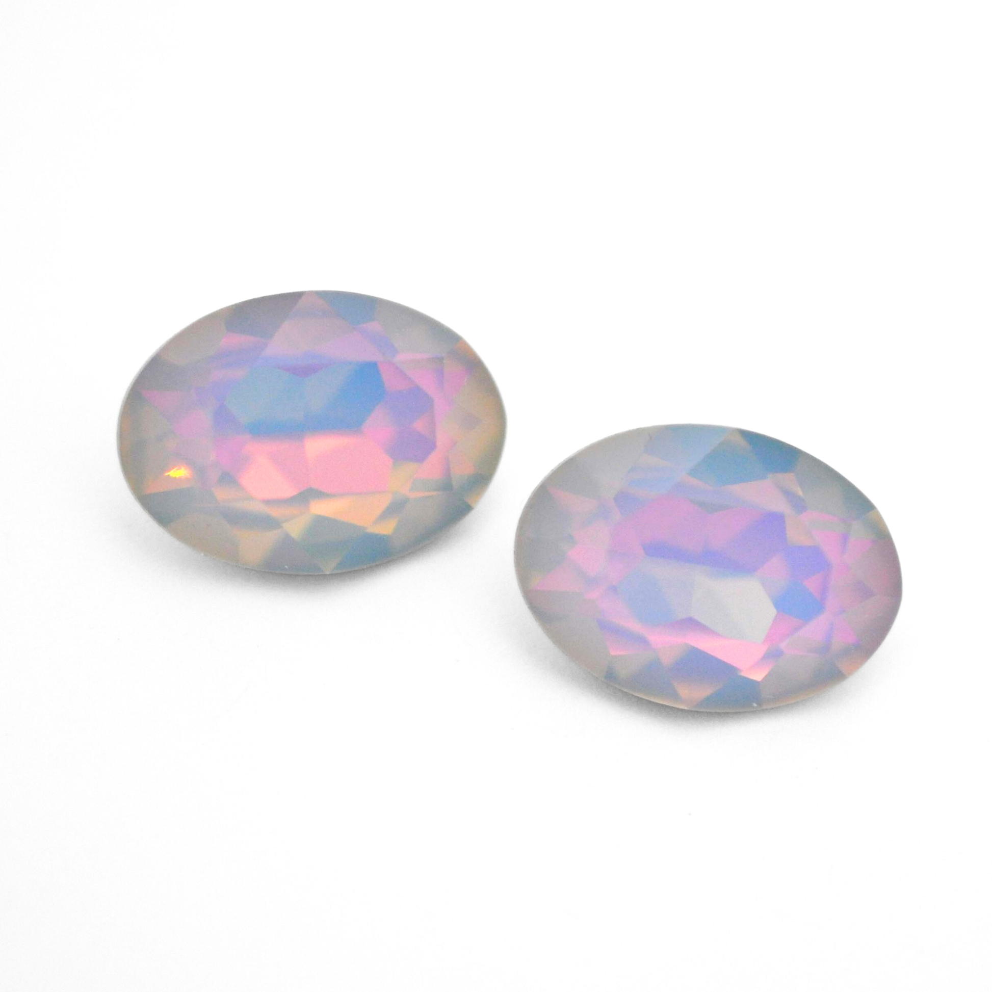 Oval shape faceted Austrian crystal rhinestones in the color Dreamy Vitrail displayed on a white background.