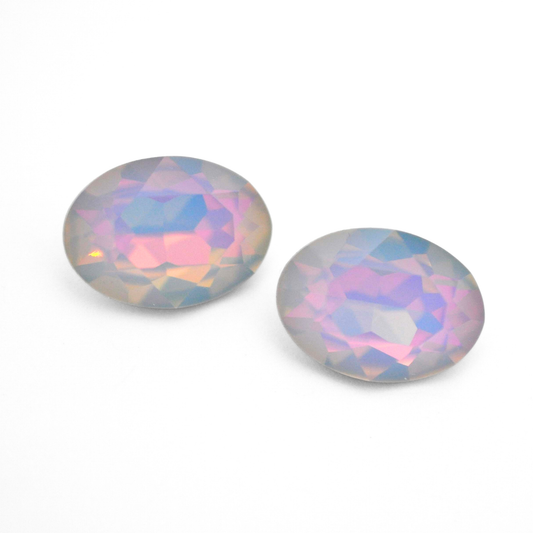 Oval shape faceted Austrian crystal rhinestones in the color Dreamy Vitrail displayed on a white background.