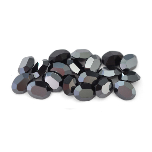 Oval shaped faceted Austrian crystal rhinestones in the color Jet Hematite displayed on a white background. 