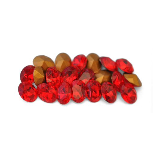 Oval shaped faceted Austrian crystal rhinestones in the color Light Siam displayed on a white background. 