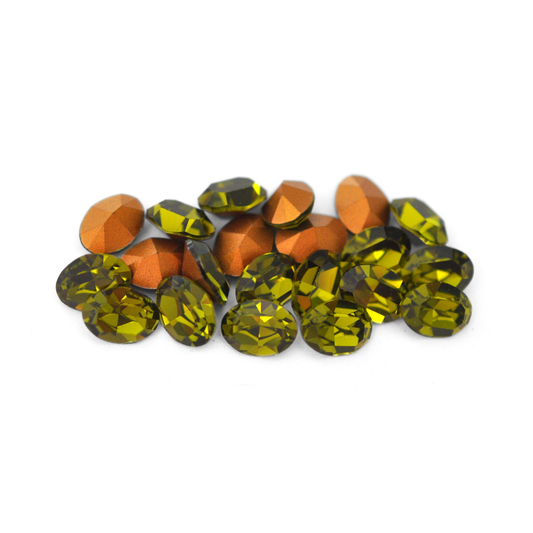Oval shaped faceted Austrian crystal rhinestones in the color Olivine displayed on a white background. 