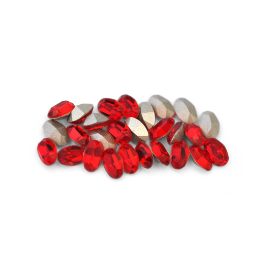 Oval shaped faceted Austrian crystal rhinestones in the color Light Siam displayed on a white background. 