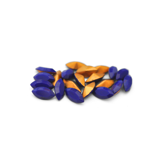 Navette shaped faceted Austrian crystal rhinestones in the color Navy Blue displayed on a white background.