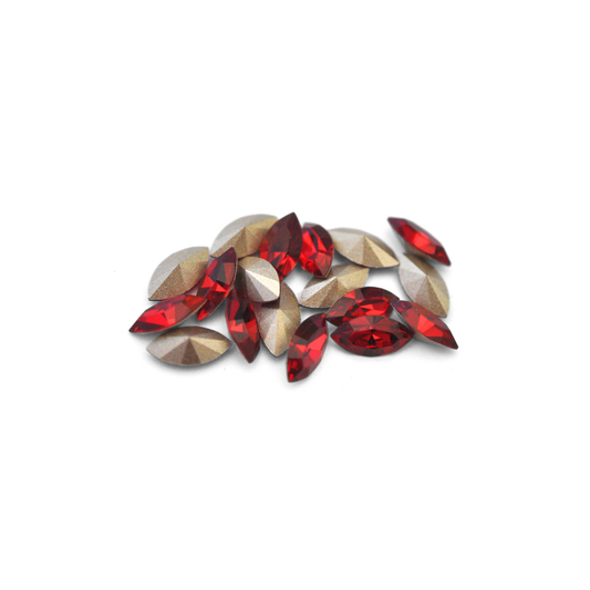 Navette shaped faceted Austrian crystal rhinestones in the color Siam displayed on a white background.